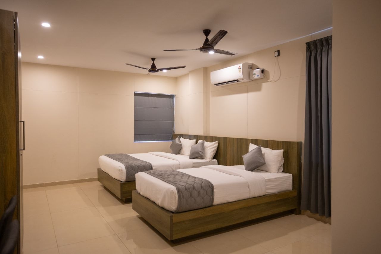 Spacious luxury family room at Hotel Grand Blue Star featuring a separated sleeping area and an ocean-facing balcony