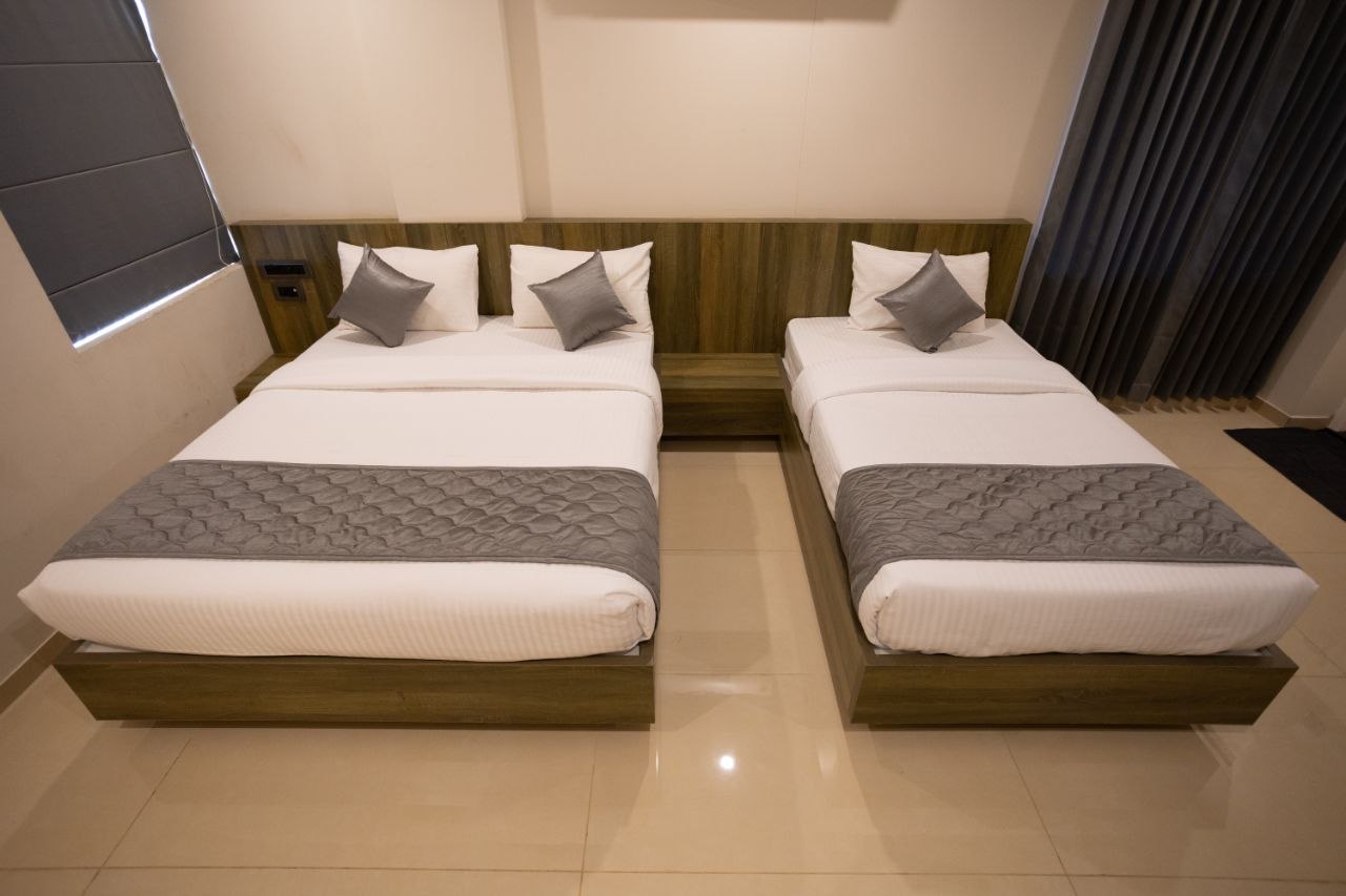 Peaceful single room curated for solo travelers with a premium bed, reading nook, and sleek interior design